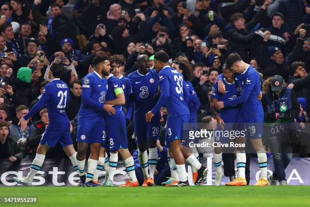 Raheem Sterling of Chelsea celebrates with teammates after scoring the team's first goal during the UEFA Champions League round of 16 leg two match...