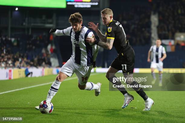 John Swift of West Bromwich Albion battles for possession with James McClean of Wigan Athletic during the Sky Bet Championship between West Bromwich...