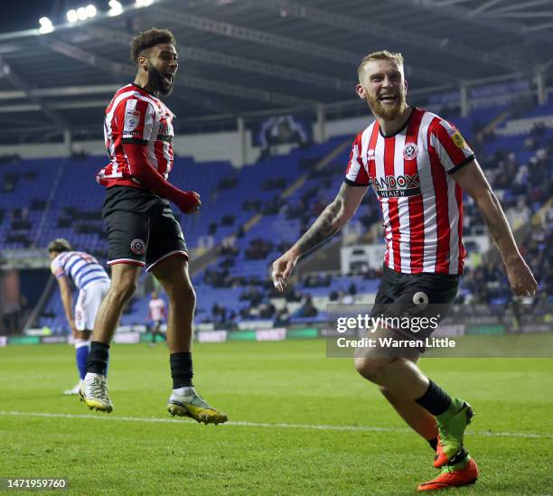 Jayden Bogle celebrates with Oliver McBurnie of Sheffield United after Iliman Ndiaye scores the team's first goal during the Sky Bet Championship...