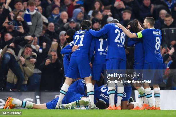 Kai Havertz of Chelsea celebrates after scoring the team's first goal from a penalty kick with teammates during the UEFA Champions League round of 16...