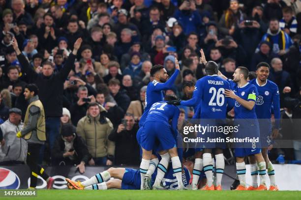 Kai Havertz of Chelsea celebrates after scoring the team's first goal from a penalty kick with teammates during the UEFA Champions League round of 16...