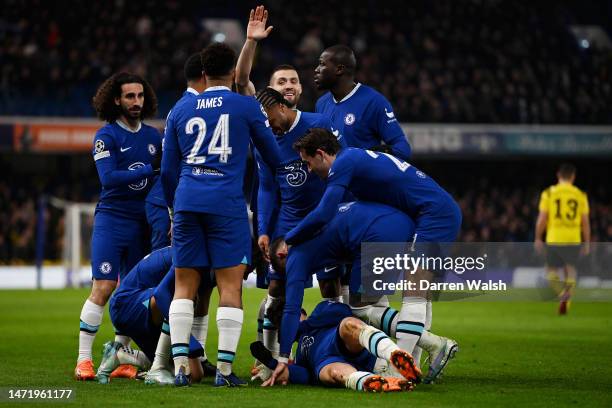 Kai Havertz of Chelsea celebrates after scoring the team's second goal from a penalty kick with teammates during the UEFA Champions League round of...