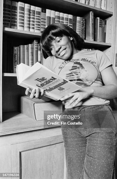 1st FEBRUARY: American singer Stephanie Mills posed reading an autobiography of Muhammad Ali at home in Mount Vernon, New York in February 1976.