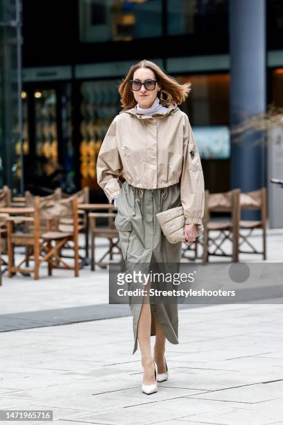 Influencer and style icon Annette Weber, wearing a khaki colored military skirt by Brunello Cuccinelli, a short beige blouson by Brunello Cuccinelli,...