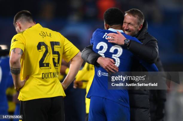 Wesley Fofana embraces Graham Potter, Manager of Chelsea, after the UEFA Champions League round of 16 leg two match between Chelsea FC and Borussia...