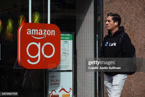 Pedestrian walks by an Amazon Go store on March 07, 2023 in San Francisco, California. Amazon announced plans to permanently shutter all four if its...