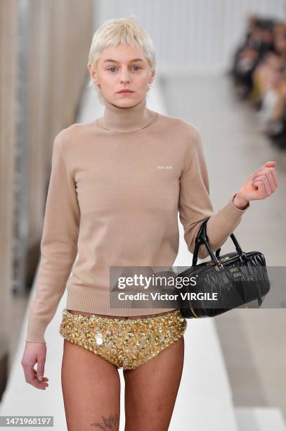 Emma Corrin walks the runway during the Miu Miu Ready to Wear Fall/Winter 2023-2024 fashion show as part of the Paris Fashion Week on March 7, 2023...