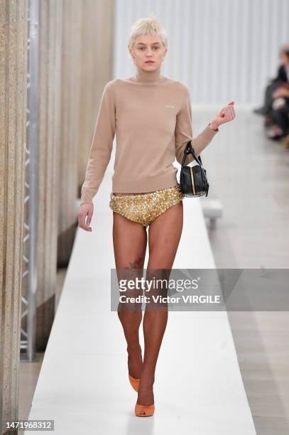 Emma Corrin walks the runway during the Miu Miu Ready to Wear Fall/Winter 2023-2024 fashion show as part of the Paris Fashion Week on March 7, 2023...
