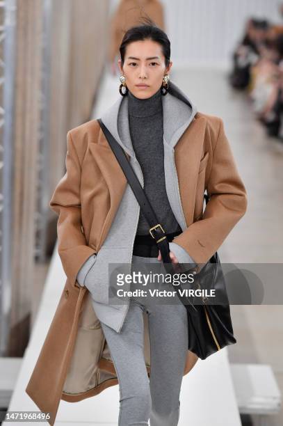 Model walks the runway during the Miu Miu Ready to Wear Fall/Winter 2023-2024 fashion show as part of the Paris Fashion Week on March 7, 2023 in...