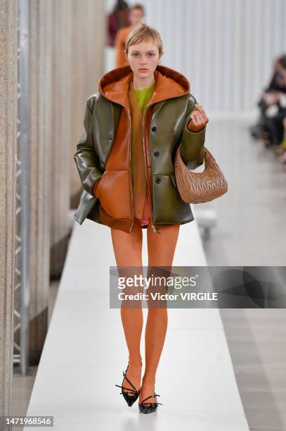Model walks the runway during the Miu Miu Ready to Wear Fall/Winter 2023-2024 fashion show as part of the Paris Fashion Week on March 7, 2023 in...