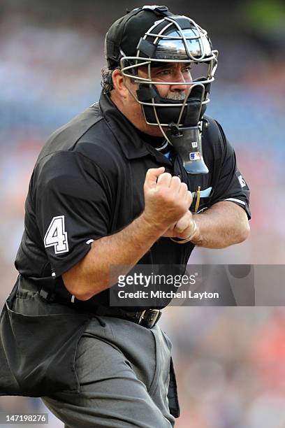 Umpire Tim Tschida calls a strike during an interleague baseball game between the Washington Nationals and the Tampa Bay Rays at National Park on...