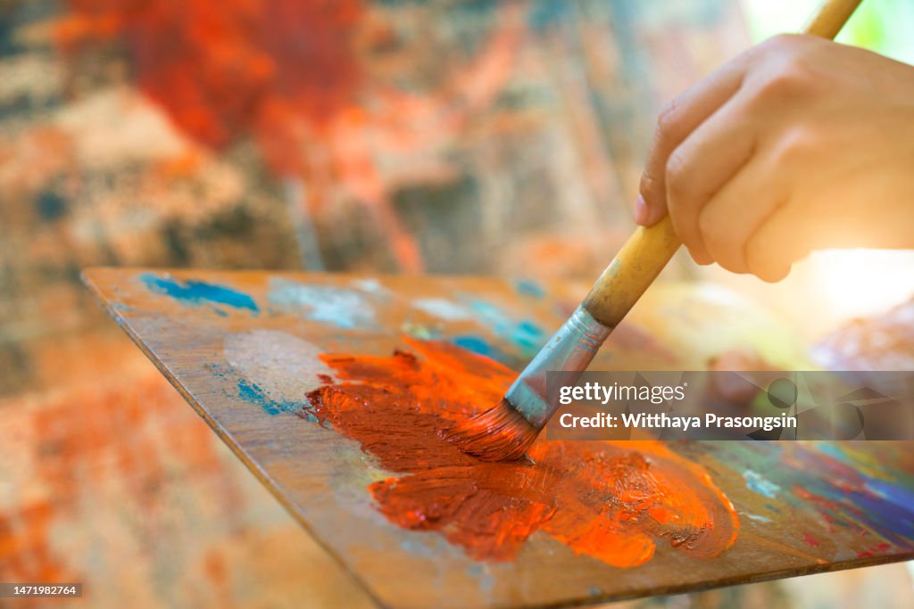 Male Artist Works on Abstract Oil Painting