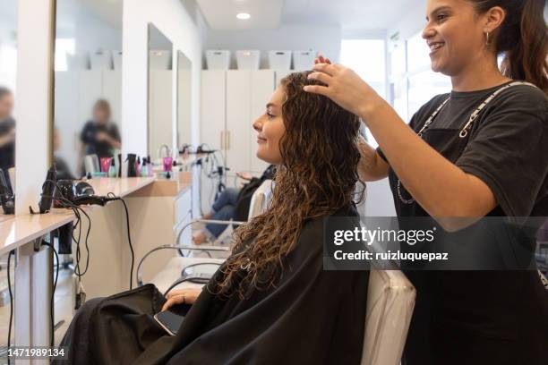 teenager in a hair salon - beautician client stock pictures, royalty-free photos & images