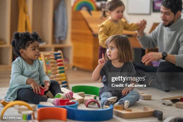 playing with blocks - daycare stock pictures, royalty-free photos & images