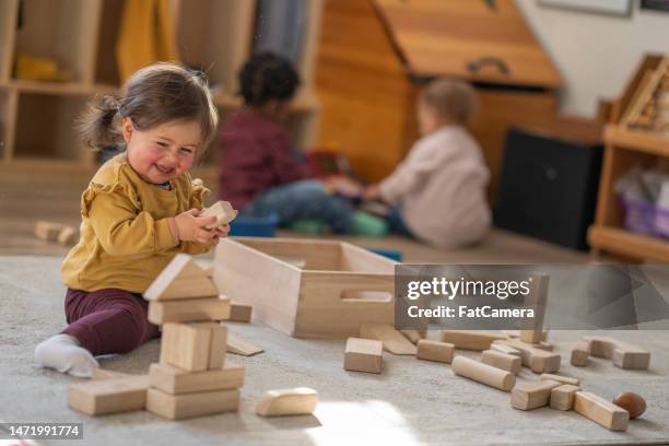 little girl playing with blocks - baby playing stock pictures, royalty-free photos & images