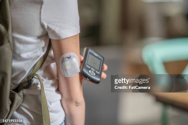 diabetic scanning - insulin pump stock pictures, royalty-free photos & images