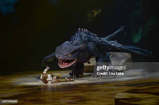 Riley Miner as "Hiccup" and night fury dragon "Toothless" scene during a preview of DreamWorks' "How To Train Your Dragon Live Spectacular" North...