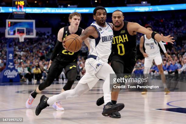 Kyrie Irving of the Dallas Mavericks drives to the basket against Talen Horton-Tucker of the Utah Jazz in the second quarter at American Airlines...