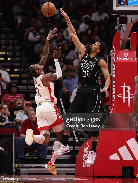 Kevin Porter Jr. #3 of the Houston Rockets shoots over Spencer Dinwiddie of the Brooklyn Nets during the third quarter at Toyota Center on March 07,...