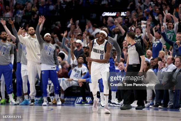 Justin Holiday of the Dallas Mavericks celebrates after making a three-point basket against the Utah Jazz in the fourth quarter at American Airlines...