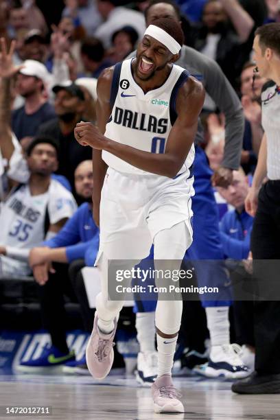 Justin Holiday of the Dallas Mavericks celebrates after making a three-point basket against the Utah Jazz in the fourth quarter at American Airlines...