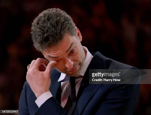 Pau Gasol of the Los Angeles Lakers wipes away tears during his jersey retirement ceremony at halftime in the game between the Memphis Grizzlies and...