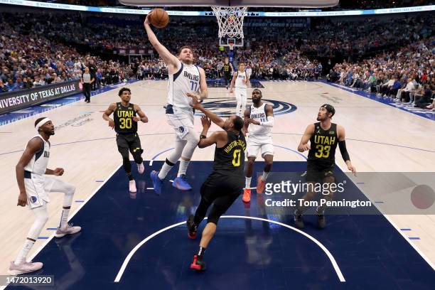 Luka Doncic of the Dallas Mavericks drives to the basket against Talen Horton-Tucker of the Utah Jazz in the second half at American Airlines Center...