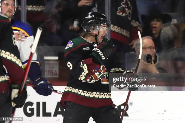 Clayton Keller of the Arizona Coyotes celebrates after scoring a goal during the third period at Mullett Arena on March 07, 2023 in Tempe, Arizona.