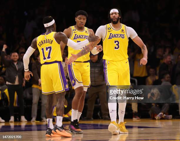 Anthony Davis of the Los Angeles Lakers celebrates his basket with Dennis Schroder and Rui Hachimura during a 112-103 Lakers win over the Memphis...