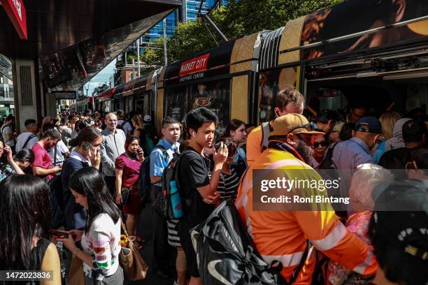 Commuters wait for light rail service at Town Hall Station on March 08, 2023 in Sydney, Australia. Sidney trains ground to a halt shortly before the...