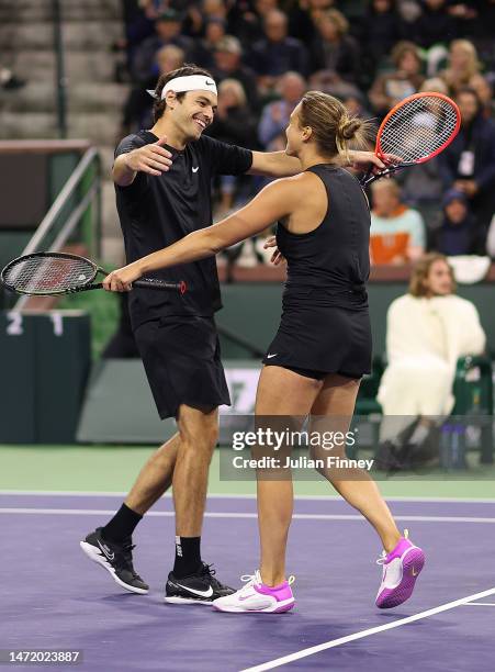 Aryna Sabalenka and Taylor Fritz of USA celebrate winning the Eisenhower Cup after taking the Tie Break Tens title during the BNP Paribas Open on...