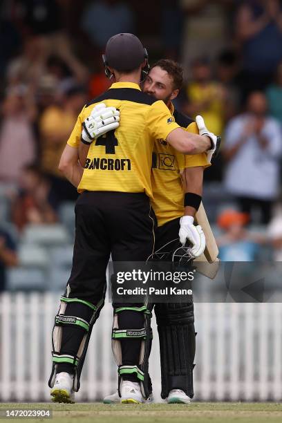 Josh Inglis of Western Australia celebrates his century with Cameron Bancroft during the Marsh One Day Cup Final match between Western Australia and...