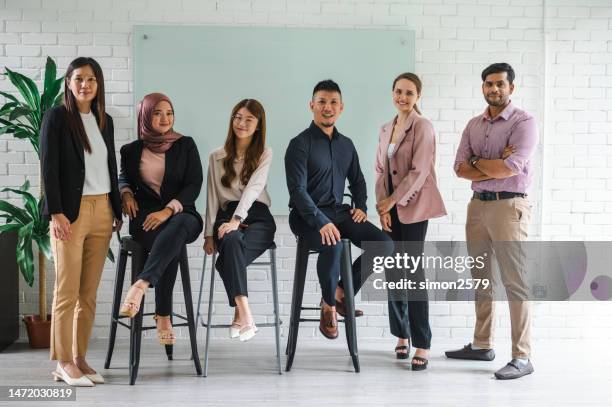 embracing our differences: multiracial business seminar on diversity and unity - smart casual stock pictures, royalty-free photos & images