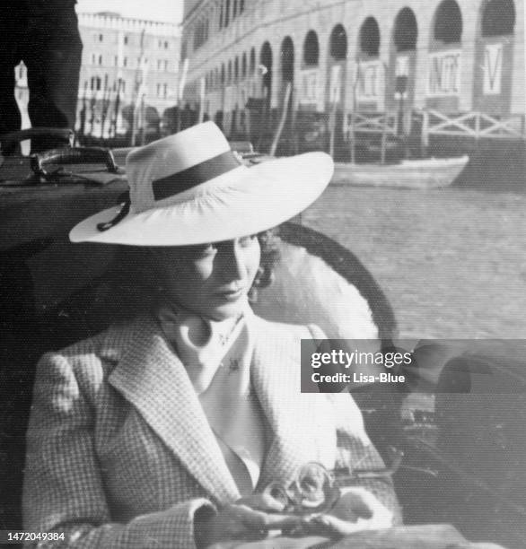 young beautiful woman on gondola in venice in 1941. - vintage italy stock pictures, royalty-free photos & images