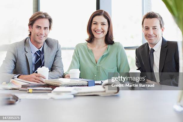 portrait of smiling business people with coffee at table - coffee table front view stock pictures, royalty-free photos & images