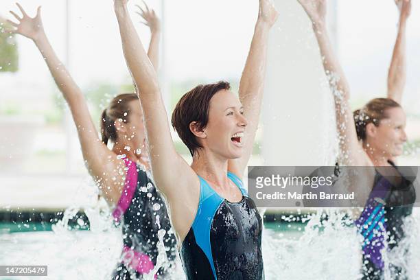enthusiastic women jumping in swimming pool - inside human mouth stock pictures, royalty-free photos & images