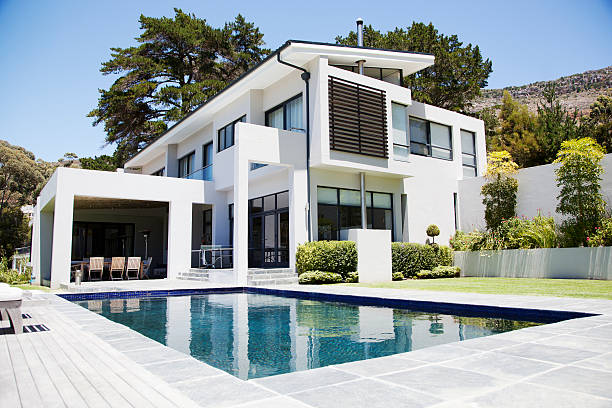 modern home with swimming pool - modern stock pictures, royalty-free photos & images