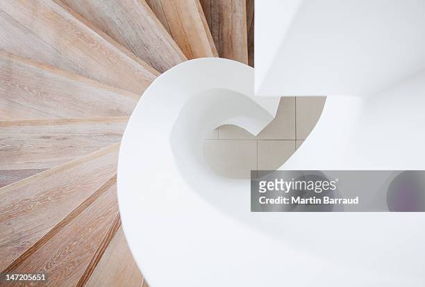 high angle view of curving staircase - architectuur stockfoto's en -beelden