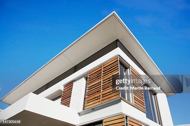 low angle view of wood shutters on modern house - shutter stock pictures, royalty-free photos & images