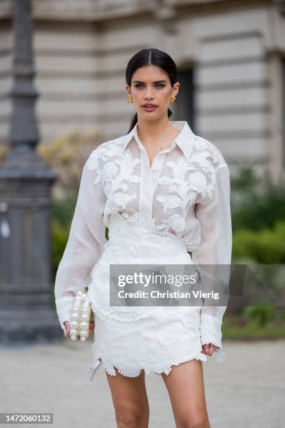 Sara Sampaio wears white embroidered blouse, skirt outside Zimmermann during Paris Fashion Week - Womenswear Fall Winter 2023 2024 : Day Eight on...