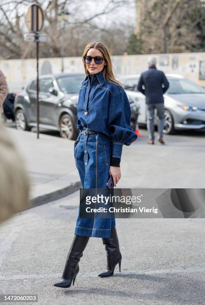 Olivia Palermo wears button up denim skirt, blouse, black heeled boots outside Zimmermann during Paris Fashion Week - Womenswear Fall Winter 2023...