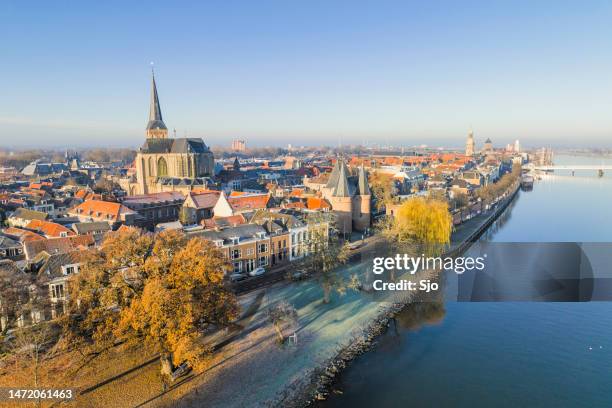 kampen city view at the river ijssel during a cold winter sunrise - kampen overijssel stock pictures, royalty-free photos & images