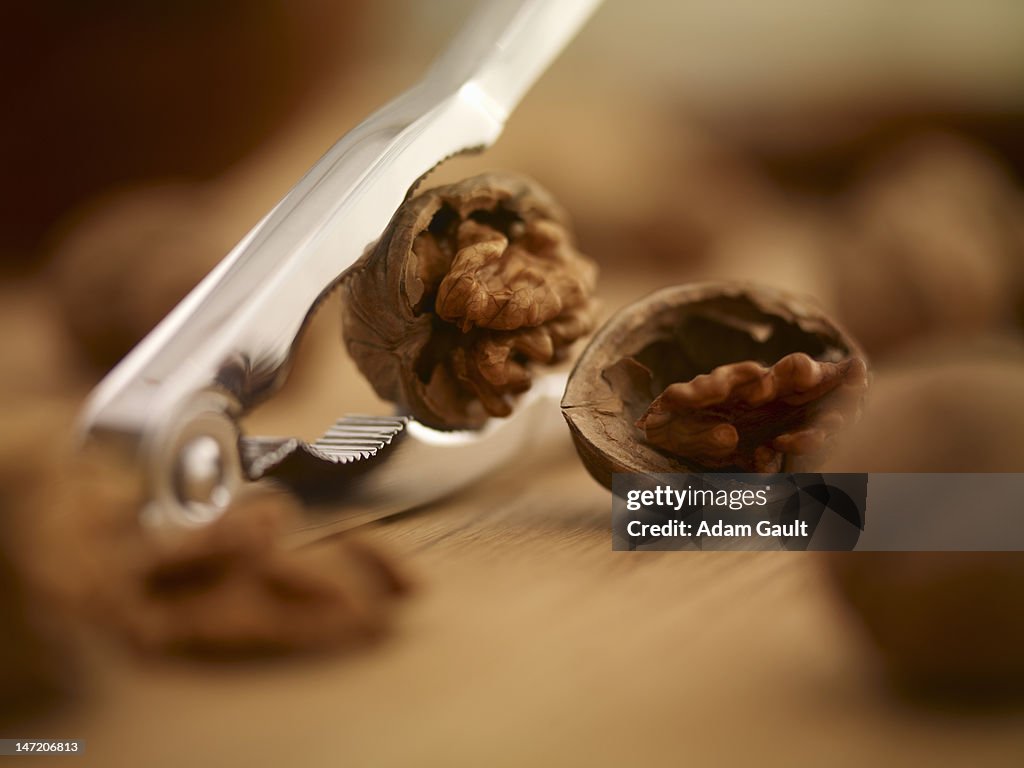 Close up of walnuts being cracked