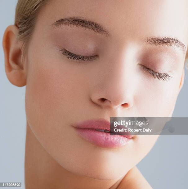 close up portrait of woman with eyes closed - eyes closed stock pictures, royalty-free photos & images