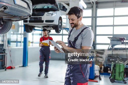 Automotive technicians at the service station Automotive technicians at the service station