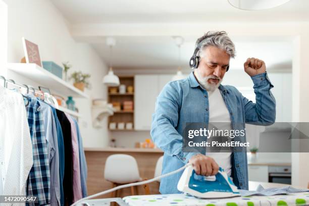 make ironing fun - person press stock pictures, royalty-free photos & images