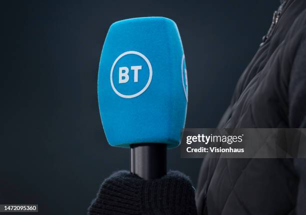 The official BT Sport microphone in the hands of a presenter ahead of the Premier League match between Manchester City and Newcastle United at Etihad...