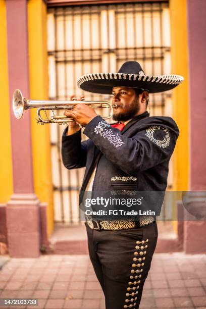 traditional mariachi trumpeter playing at the historic district - mexican embroidery stock pictures, royalty-free photos & images