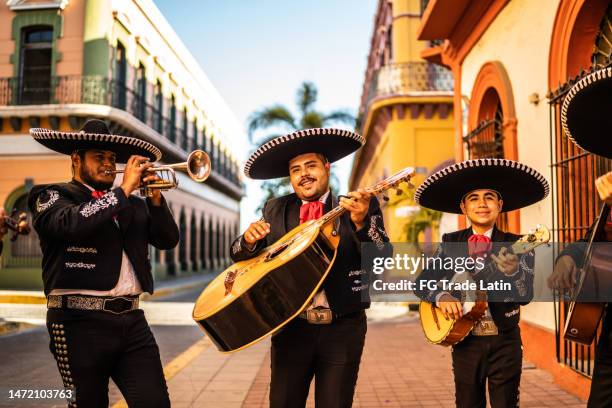 traditional mariachi group playing at the historic district - mariachi stock pictures, royalty-free photos & images