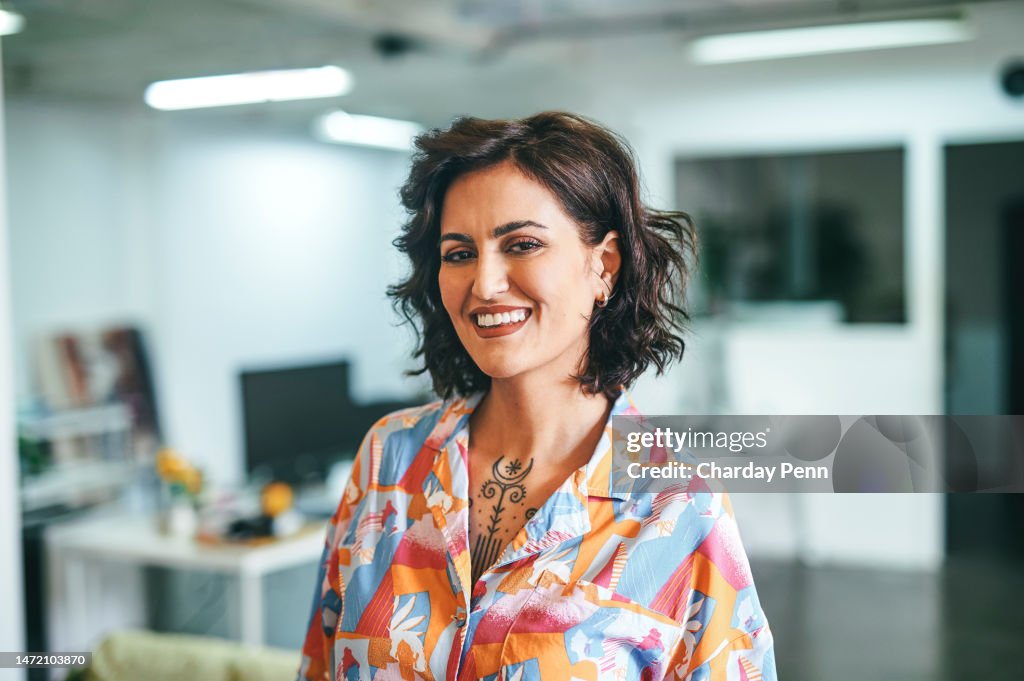 Portrait of cheerful businesswoman in office